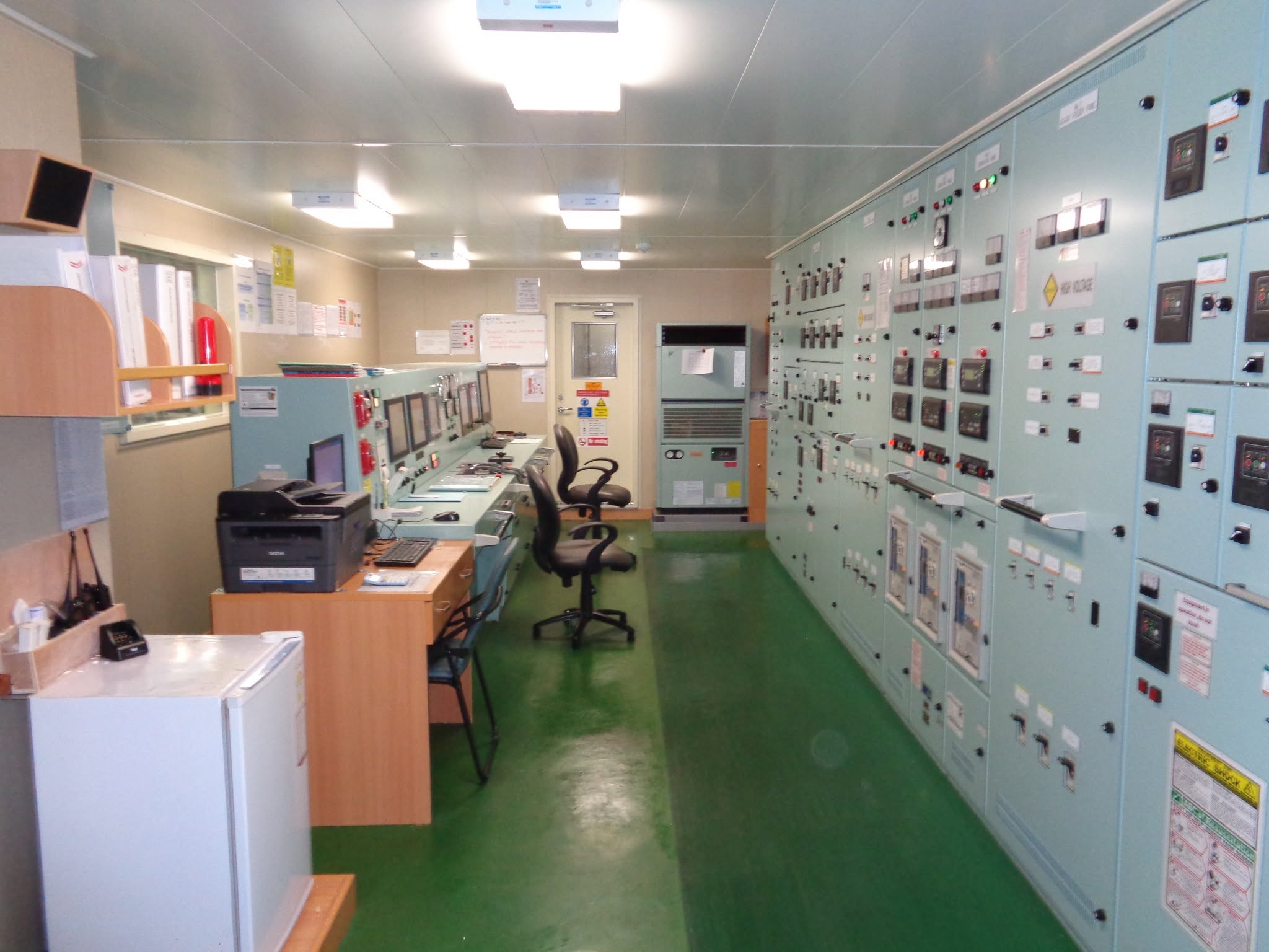 Maritime officers on duty at a modern ship bridge